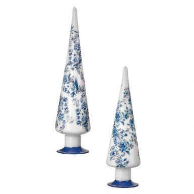 Two conical glass trees with blue floral patterns on a white background and blue bases.