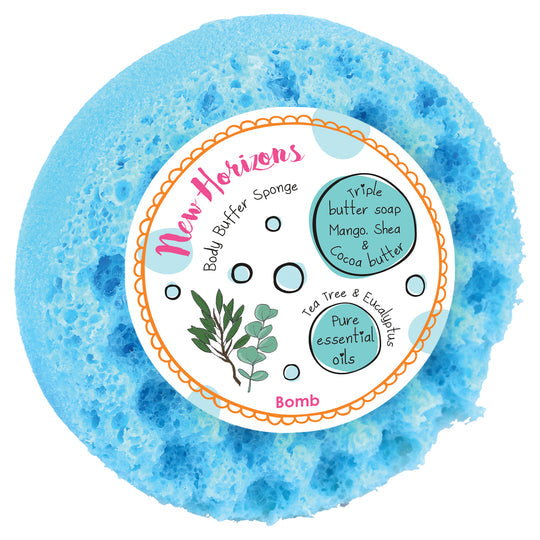 New Horizons blue body buffer sponge with label detailing triple butter soap, mango, shea, cocoa butter, tea tree, eucalyptus, and pure essential oils.