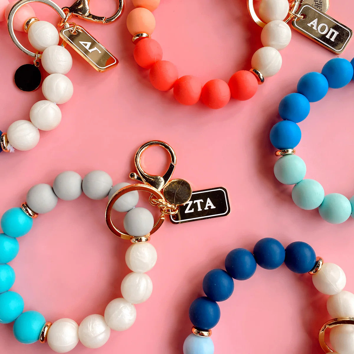 Black sorority hands-free wristlet with a detachable keychain strap.