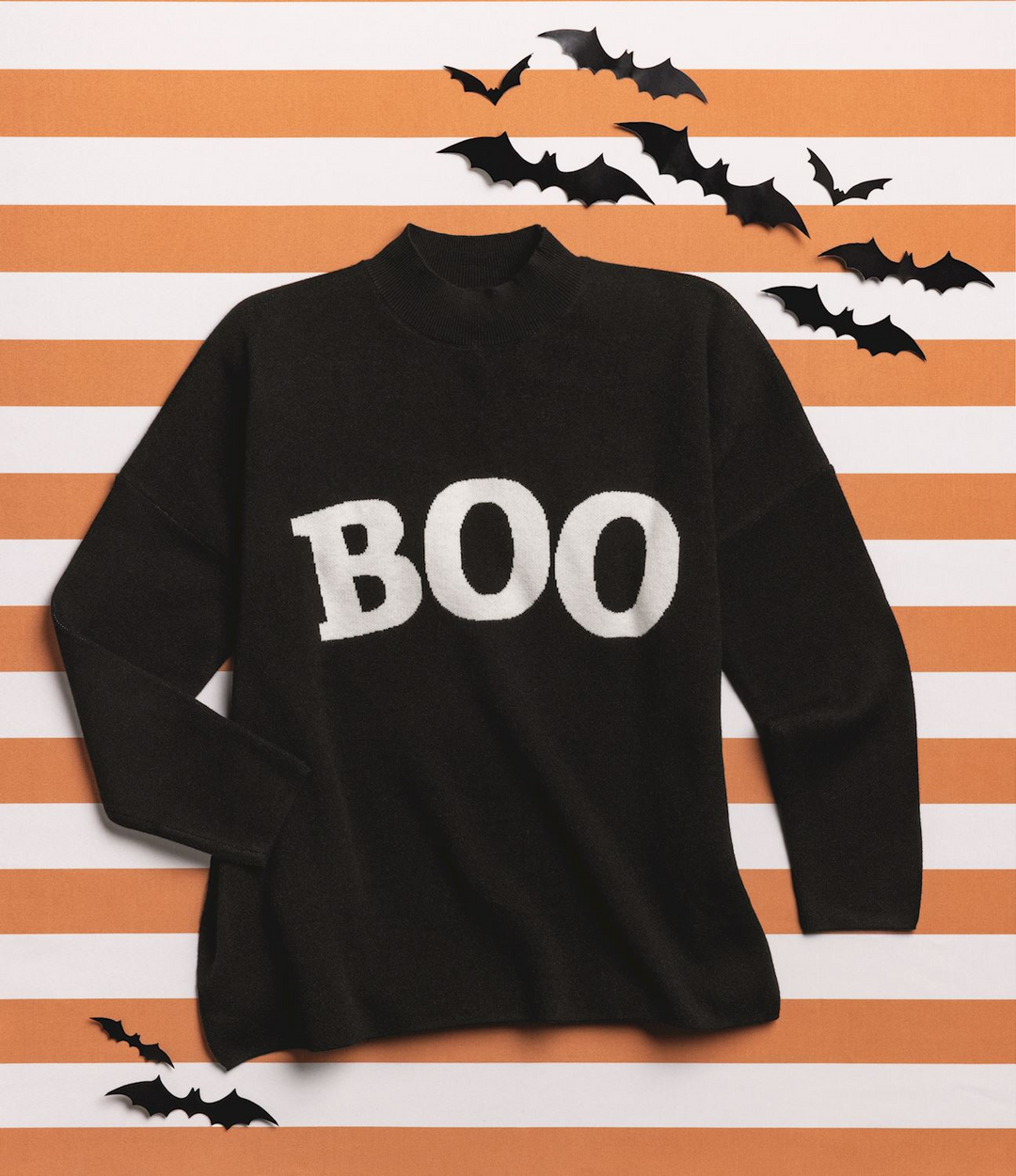 Black jacquard knit sweater with white 'BOO' text on a striped background with bat decorations.