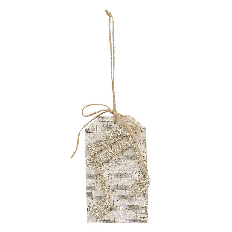 Glittered music note tag ornament with sheet music print and a jute hanging loop.