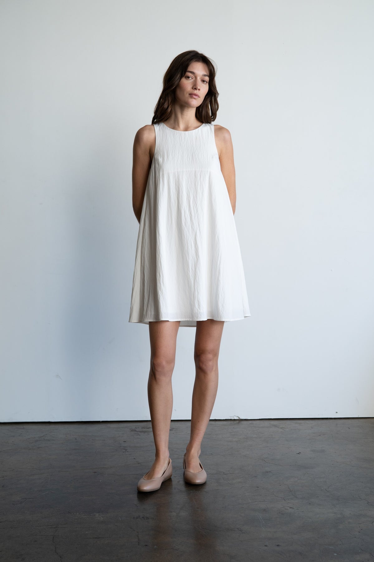 Alexis Simplicity black rayon crew neck A-line mini dress with a fitted bodice and flared skirt.