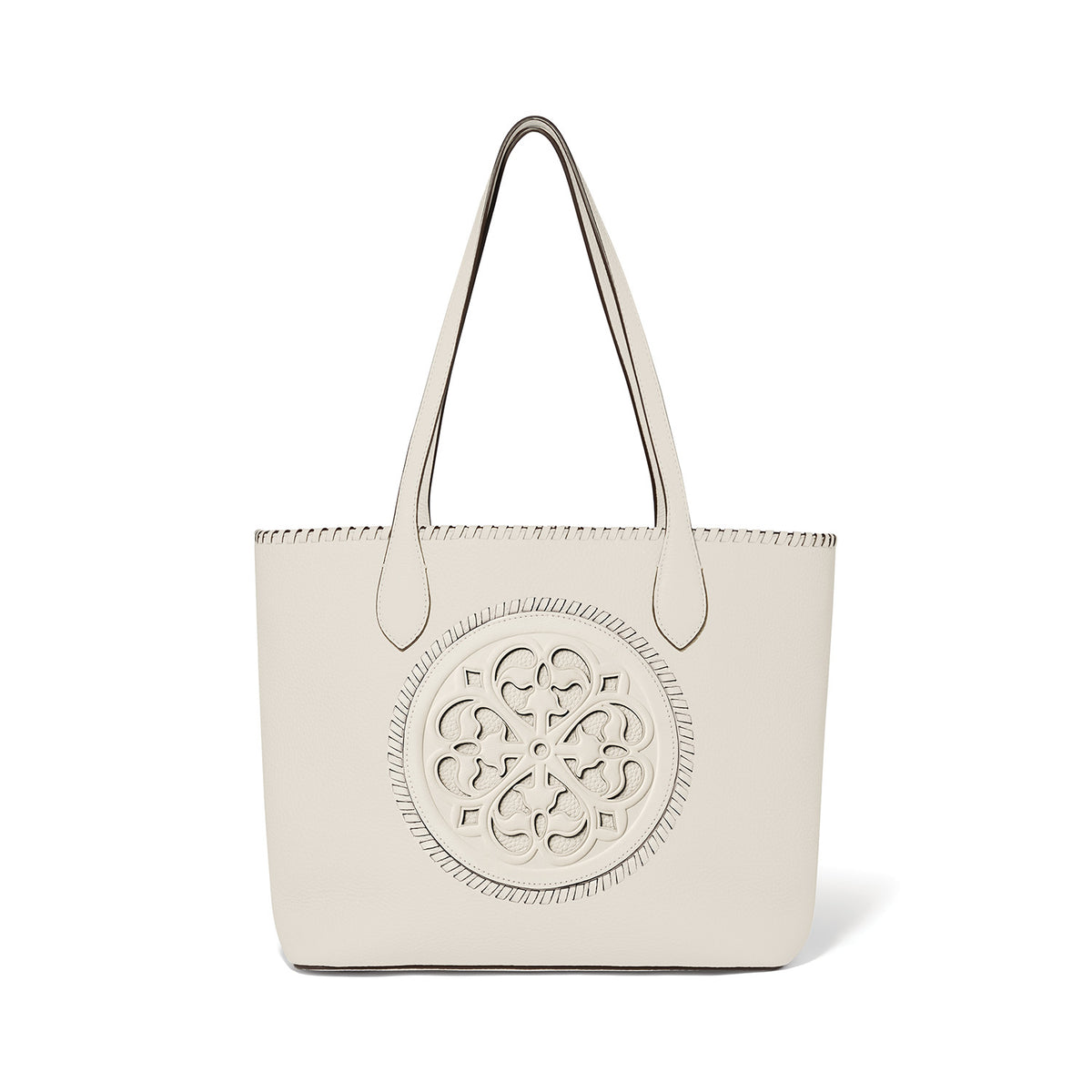 White leather Gabriella Medallion Tote with a large circular cutout floral design on the front.