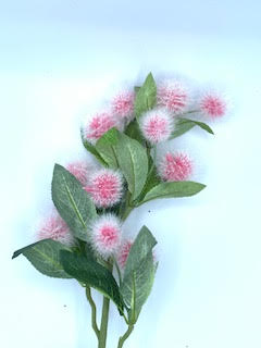 A decorative spray with fluffy pink blossoms and green leaves, resembling a Krameria flower.