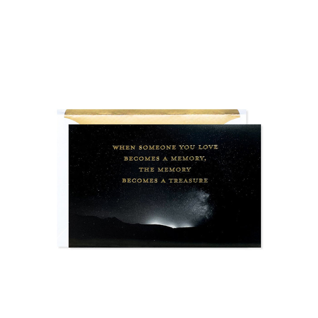 Black card with gold text reading 'When someone you love becomes a memory, the memory becomes a treasure.'