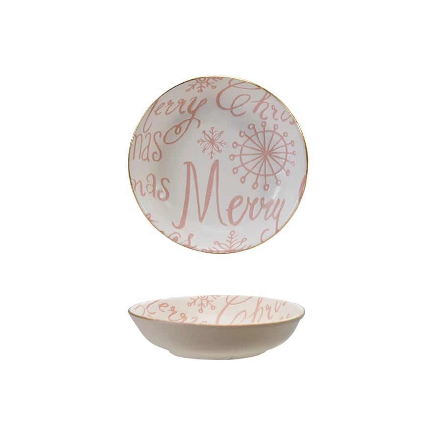 Pink stoneware Christmas dish with white interior and gold rim featuring Merry Christmas text