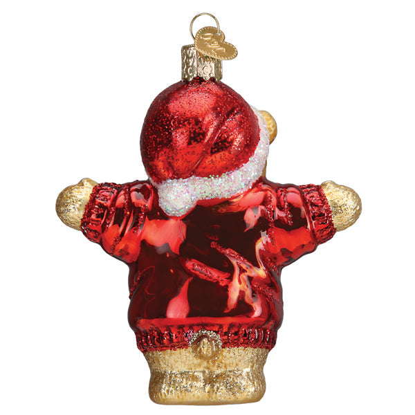 Back view of a glass bear ornament wearing a red glittery Santa hat and a red sweater.