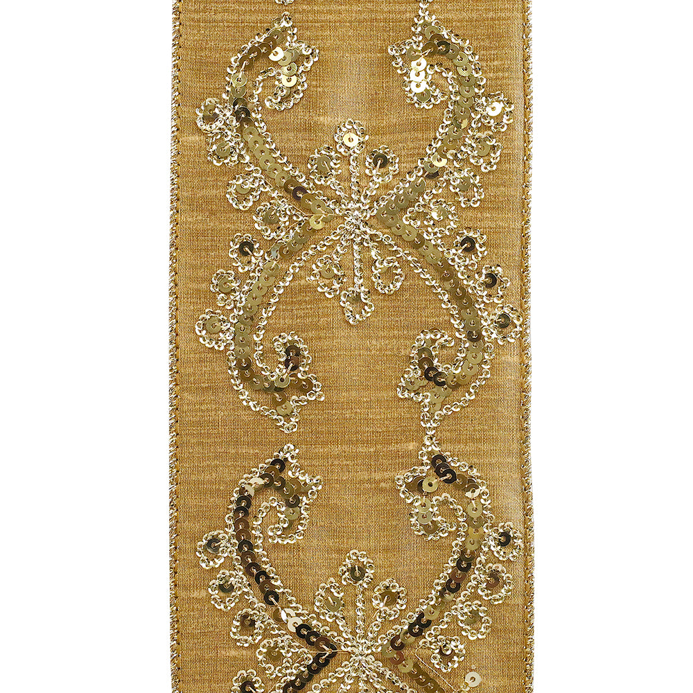 Dubai gold sequin wired edge ribbon with intricate scroll patterns on a textured fabric background.