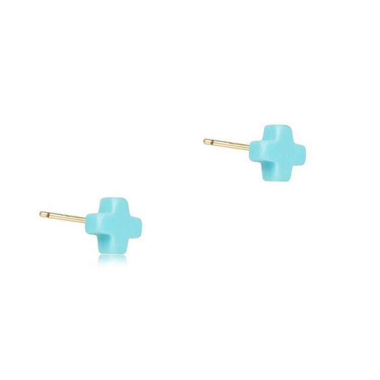Pair of small light blue cross-shaped stud earrings with gold posts.