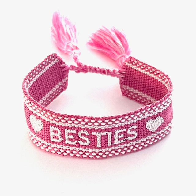Adjustable woven friendship bracelets in pastel colors with a layered stack look.