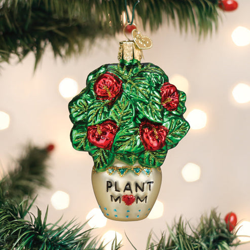 Plant Mom glass ornament featuring a green leafy plant with red flowers in a pot labeled Plant Mom.
