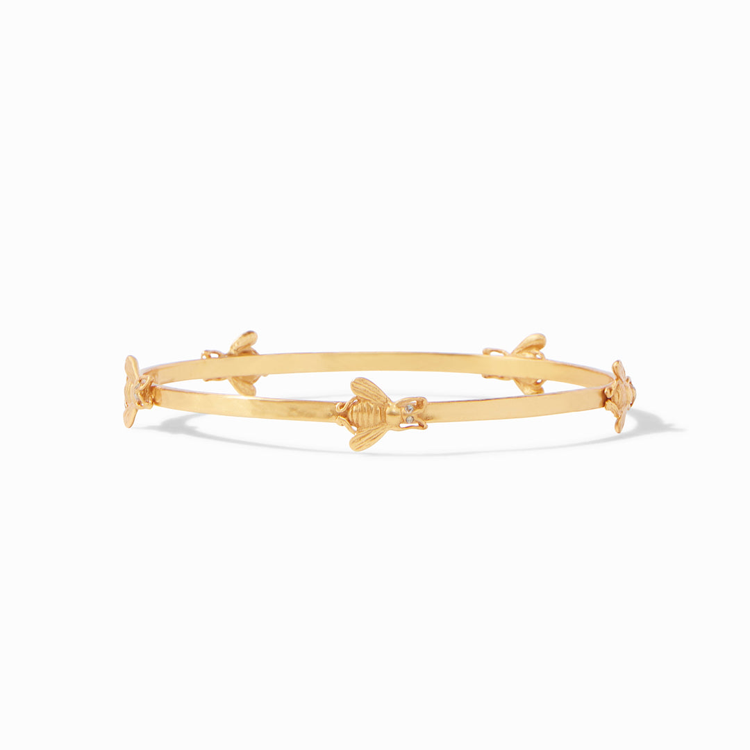 Gold-plated hammered bangle featuring small bee charms with cubic zirconia eyes.