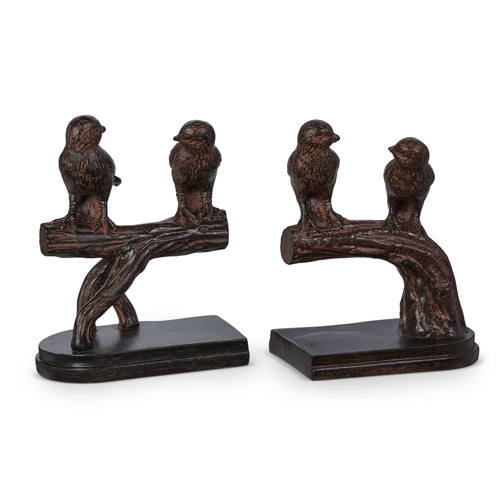 Set of two resin bookends featuring black bird silhouettes perched on a branch against a light background.