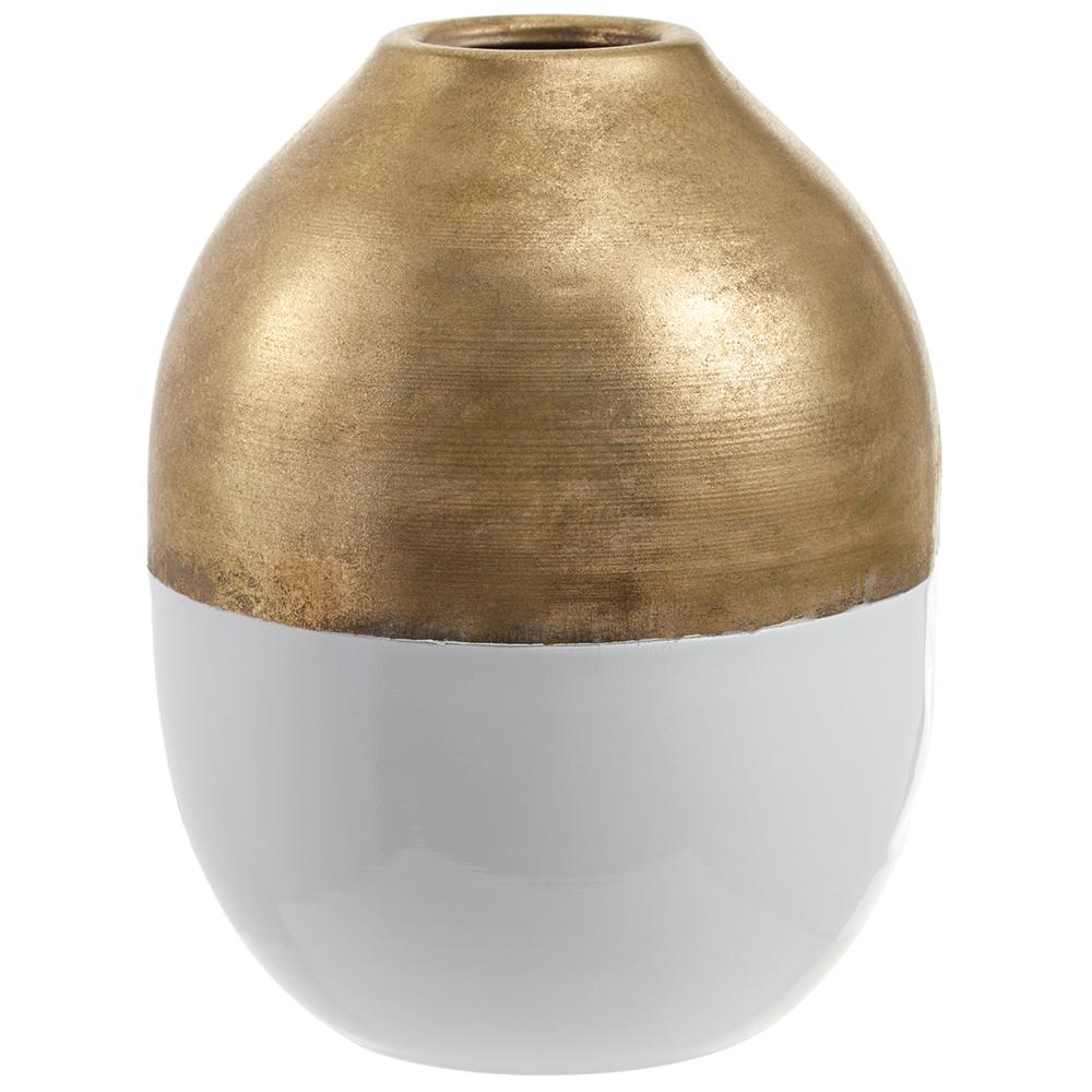 A round gold-colored metal pot with a white interior.