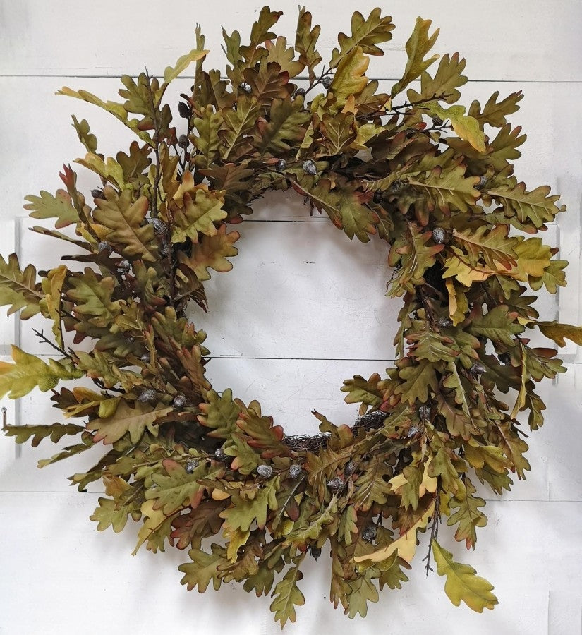 30-inch oak leaf wreath with green and brown artificial foliage and small acorns.