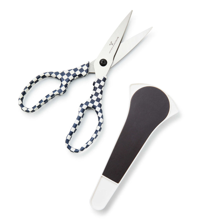Black and white check kitchen shears with stainless steel blades.