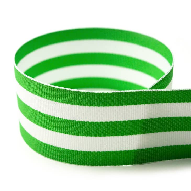 Spool of solid grosgrain ribbon with a smooth texture in neutral tone