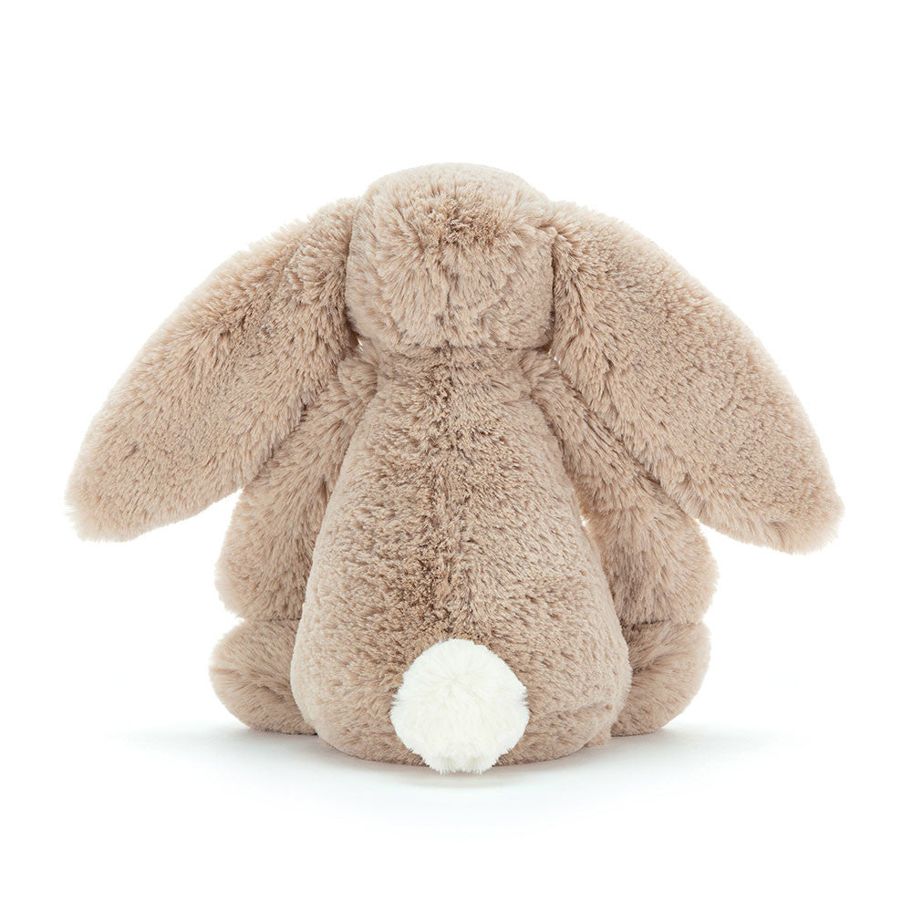 Back view of a Bashful Beige Bunny plush toy with long floppy ears and a white fluffy tail.