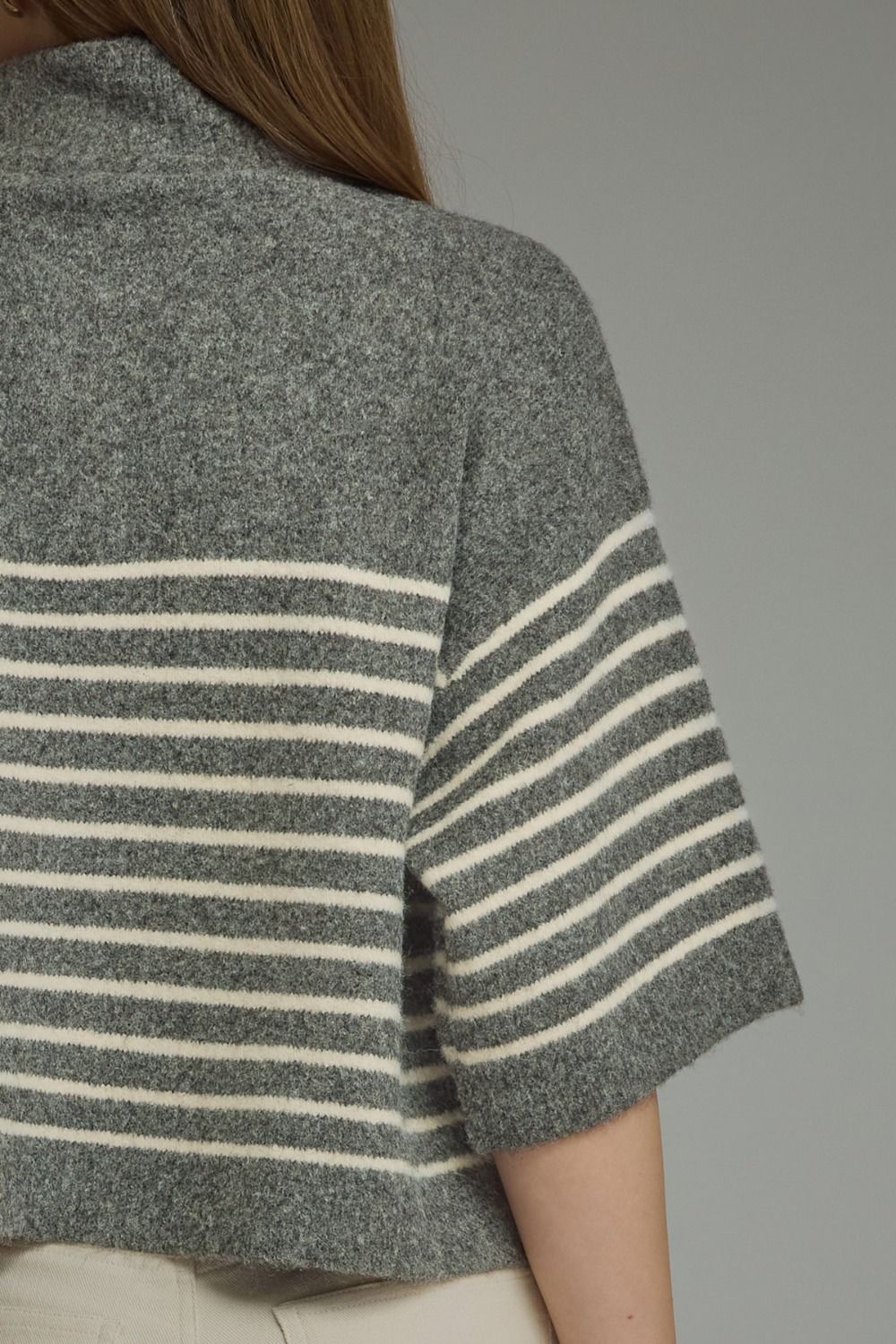 Close-up back view of the Charlene Stripe Short Sleeve Knit Top in grey with white horizontal stripes