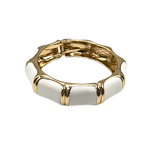 Gold-tone hinged cuff bracelet with white enamel bamboo-style segments.