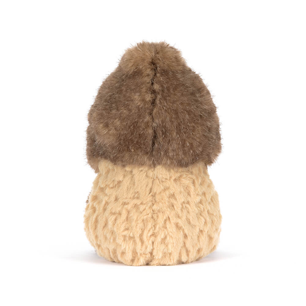 Rear view of a plush peanut toy wearing a fuzzy brown yeti hood and light tan textured body.