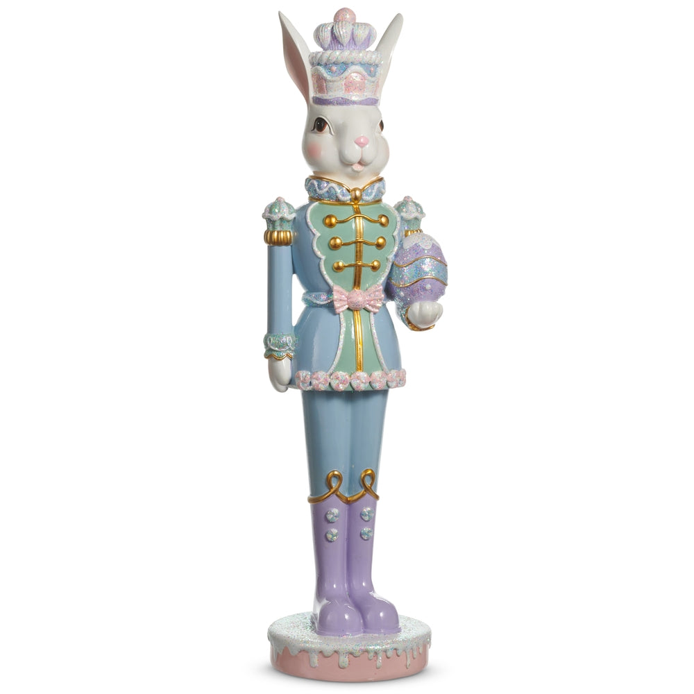 Multicolor stone powder frosted Easter bunny nutcracker holding an egg.