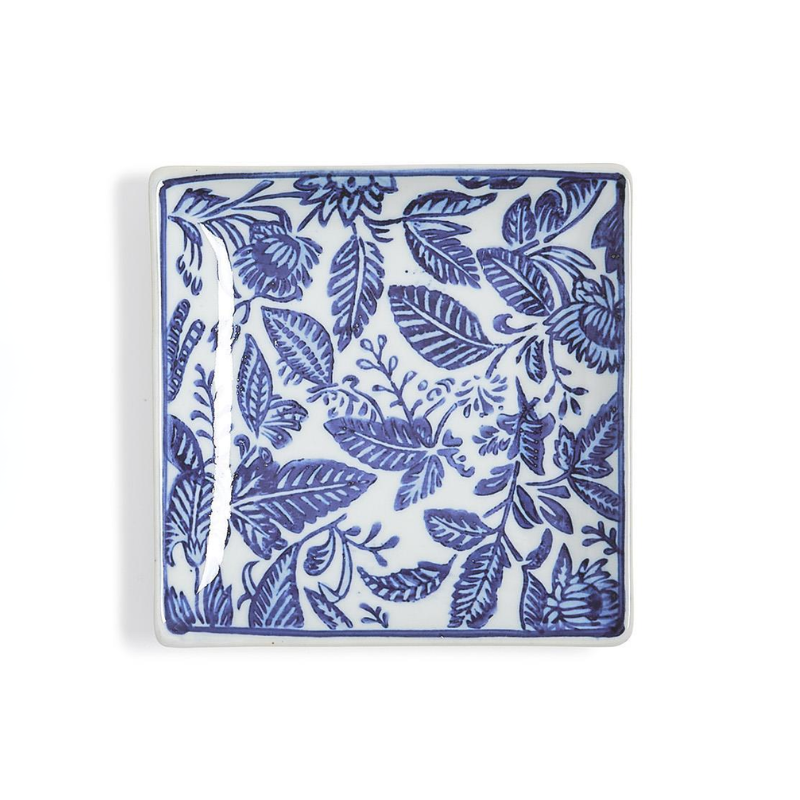 Square hand-painted blue and white chinoiserie ceramic trinket tray with floral and leaf patterns.