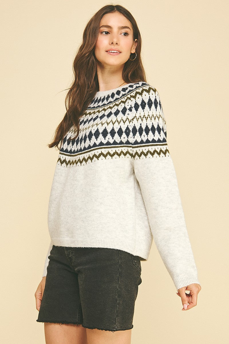 Woman wearing the Mariel Nordic Pattern Knit Sweater in Heather Grey with a Fair Isle-inspired yoke.