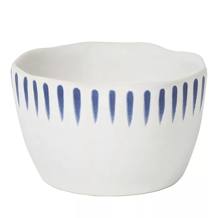 Sitio Stripe Ramekin in Delft Blue featuring a white stoneware body with blue vertical brushstrokes.