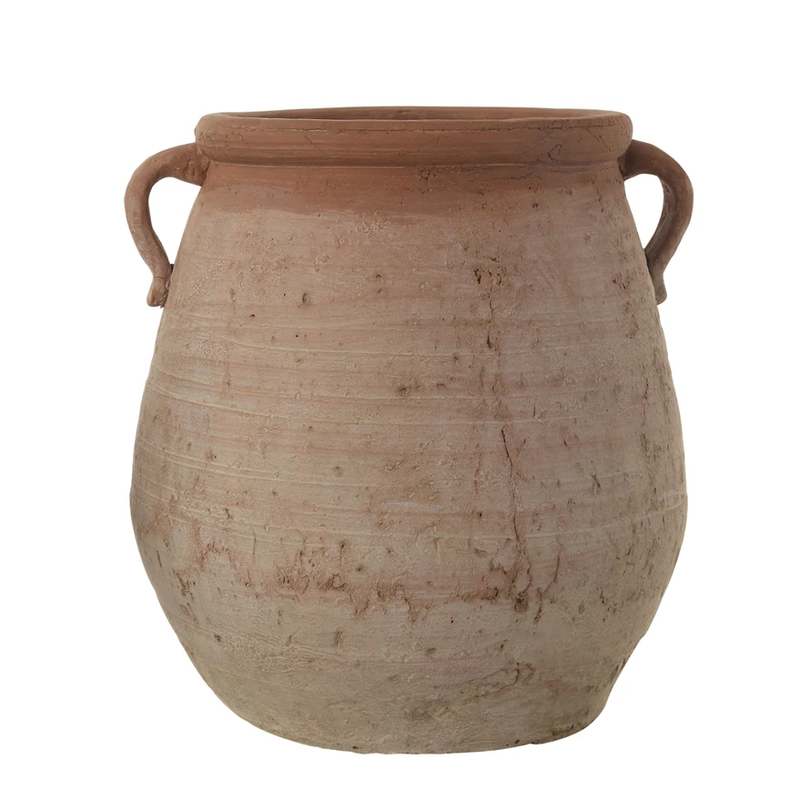 Terracotta urn with whitewash finish featuring a rounded silhouette.