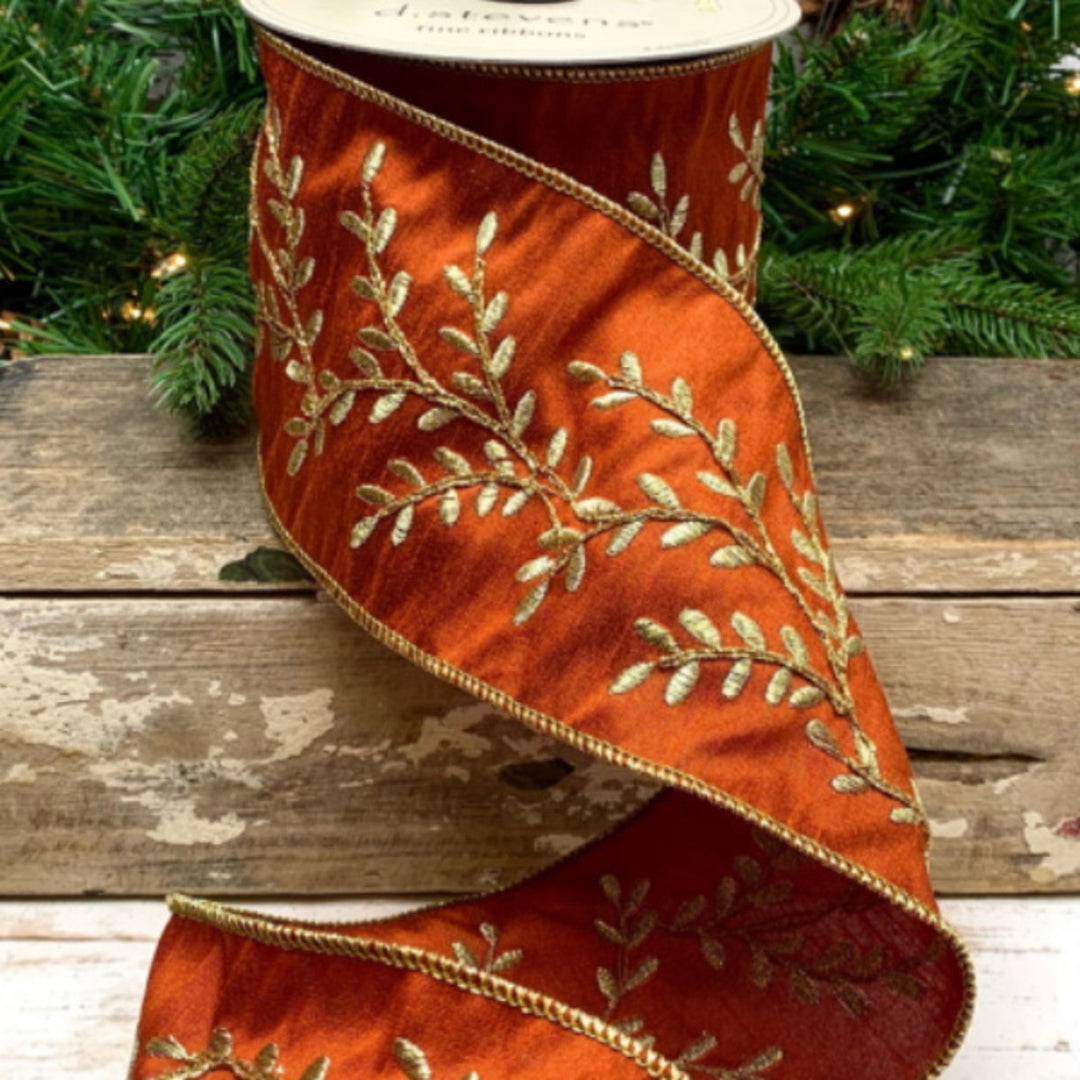 4 inch wide bittersweet orange dupion ribbon with gold embroidered vine pattern and wired edges.