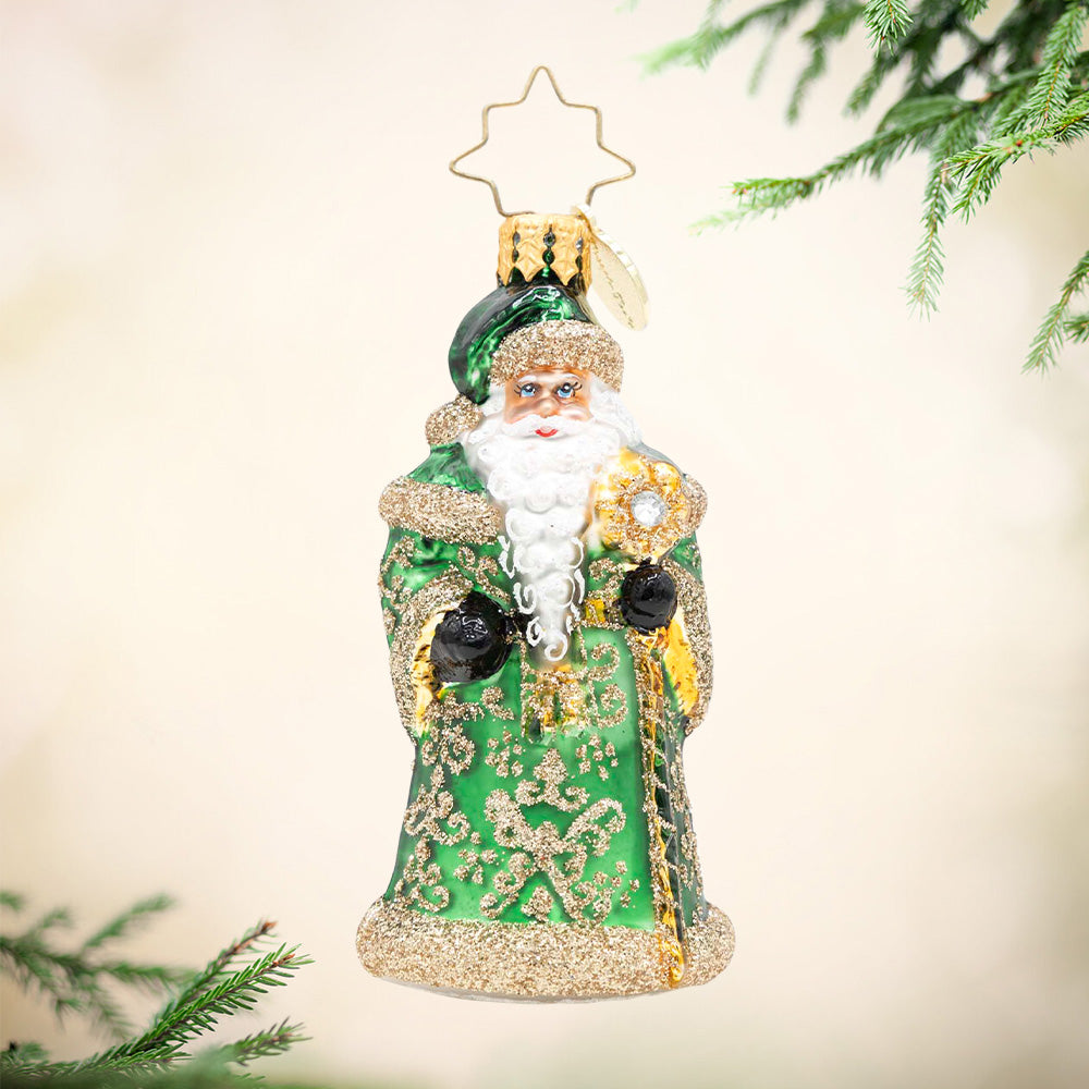 Emerald Elegance Gem Santa glass ornament in a green glittered robe with a gold star topper.