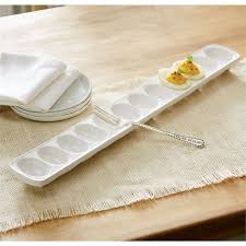 Deviled egg tray set featuring a dolomite surface with metal base.