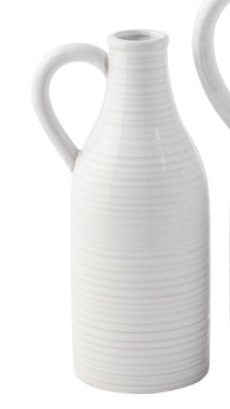 Clear glass milk jug vase with a narrow neck and wide cylindrical body.