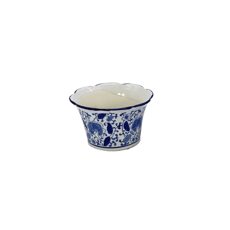 Blue and white floral ceramic pot with a ruffled lip and tapered design.