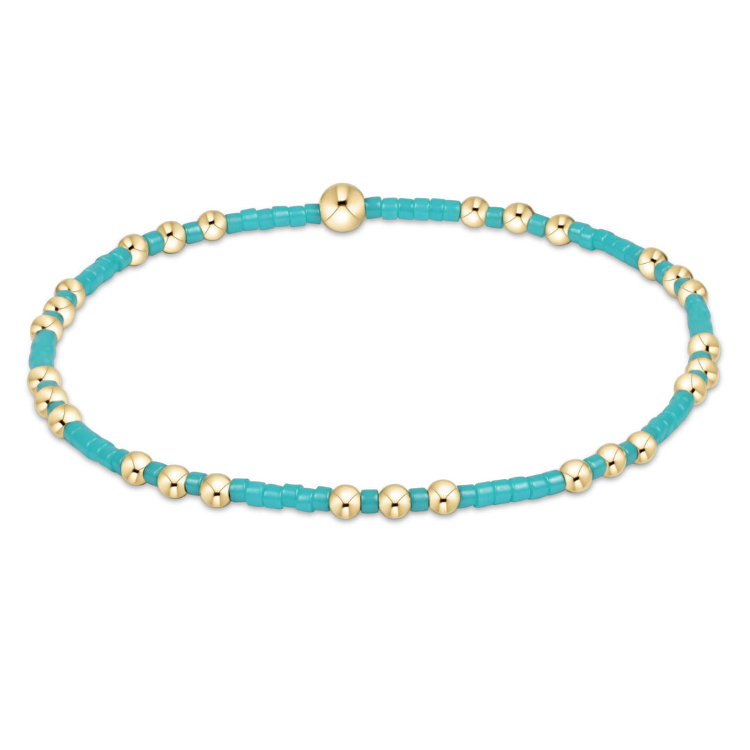Hope Joy bracelet featuring gold-filled seed beads on stretch elastic.