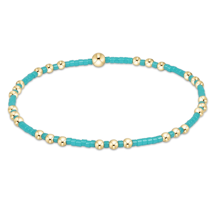 Hope Joy bracelet featuring gold-filled seed beads on stretch elastic.