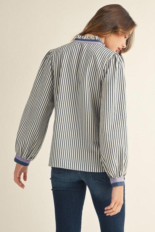Women's Emilia striped button-down top with ruffled neckline and contrast binding cuffs.