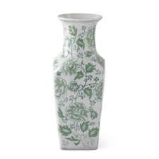 14 inch tall white ceramic vase with a green floral and leaf pattern.