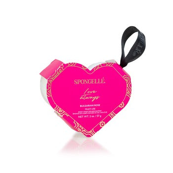 Heart-shaped body buffer sponge in white with a soft texture.