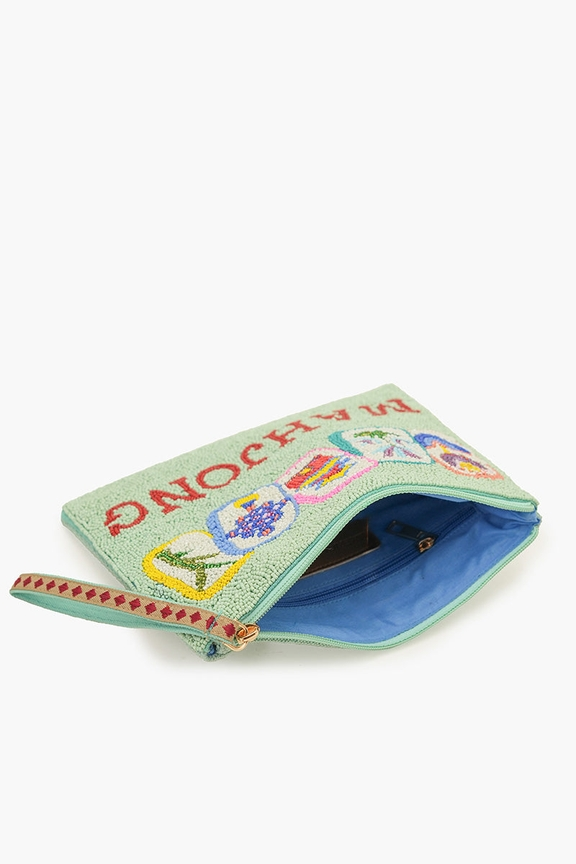 Mint green hand-beaded Mahjong clutch with tile illustrations, open to show blue lining and pocket.