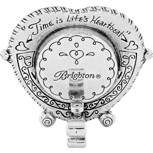Back of a silver heart-shaped clock engraved with 'Time is Life's Heartbeat' and Brighton logo.