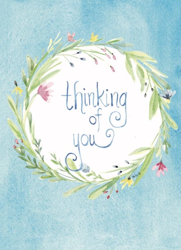 Watercolor card with a floral wreath and the words "Thinking of you" in blue script.
