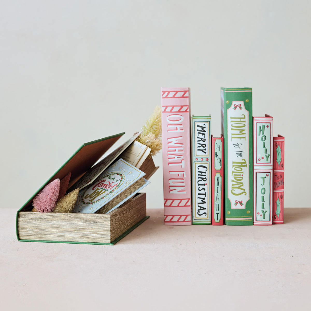 Set of three festive MDF and canvas book storage boxes with holiday-themed titles and designs.