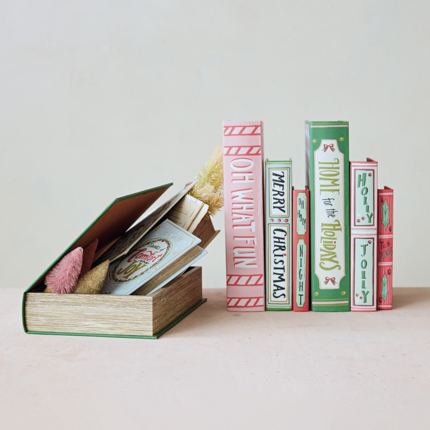 Set of three festive MDF and canvas book storage boxes with holiday-themed titles and designs.