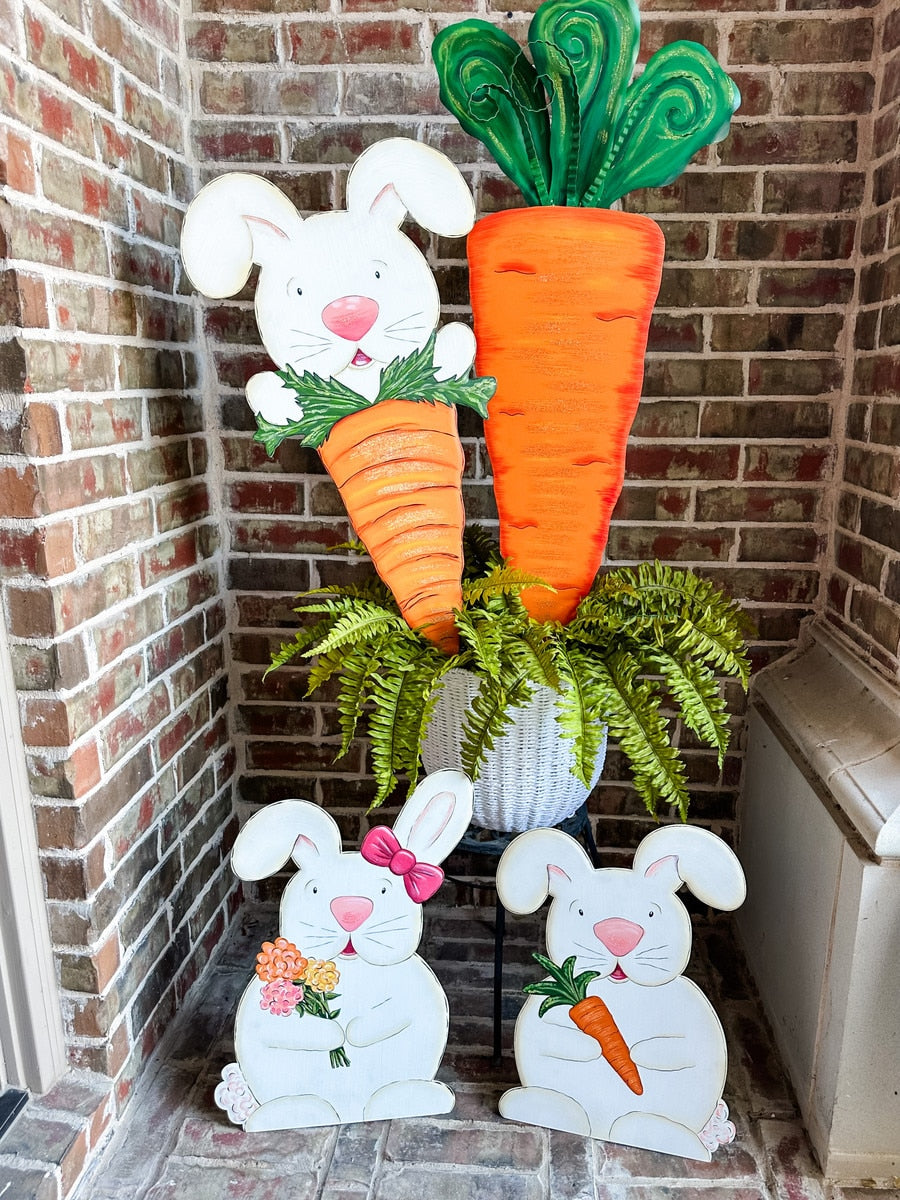 Yard Carrot stake with a natural wood finish and an integrated hanging loop.
