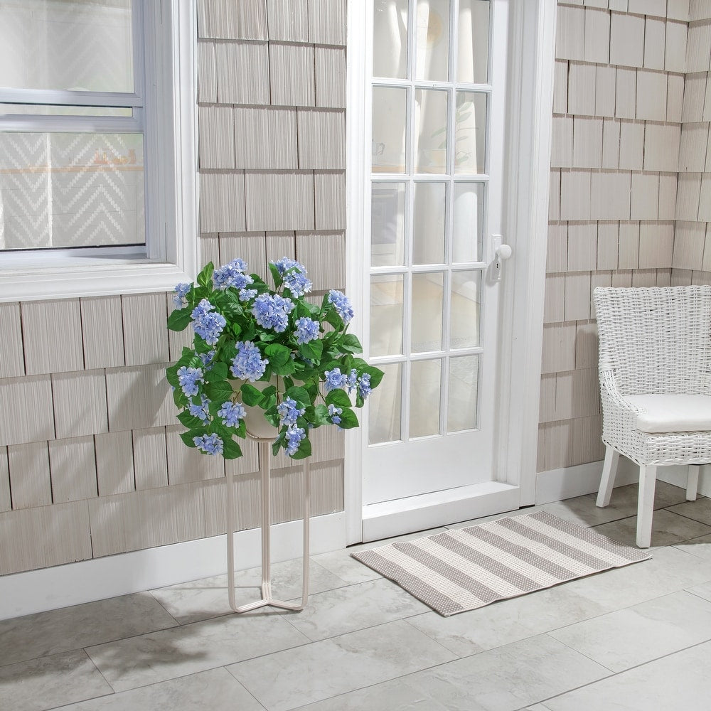 Hanging UV hydrangea plant with green foliage in a black pot
