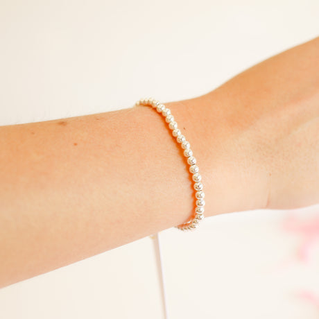 Silver beaded bracelet with a delicate chain link design