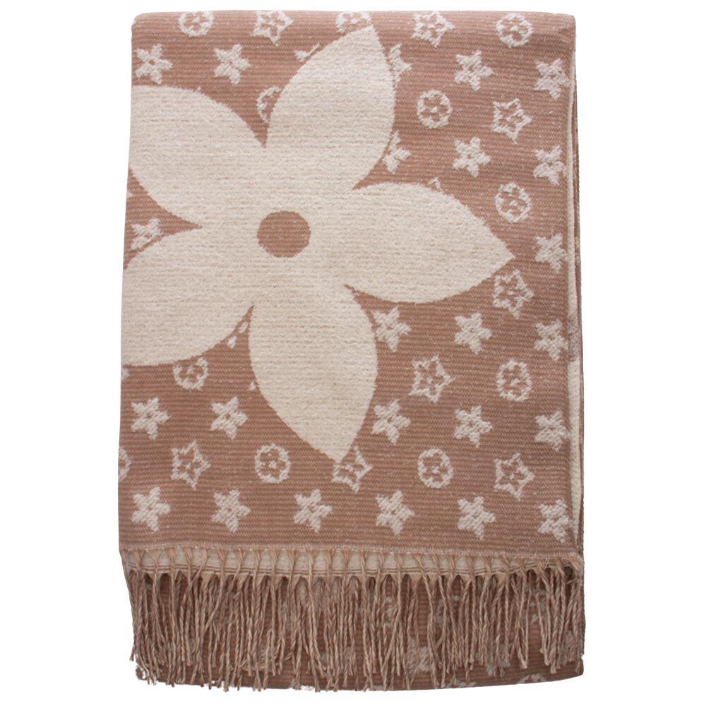 Beige oblong scarf with ribbed texture, floral print pattern, and fringed edges.