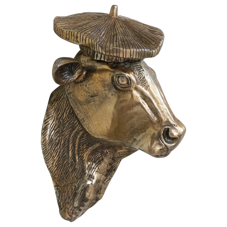 Cast aluminum cow head wall décor with a bronze finish and a textured beret hat.